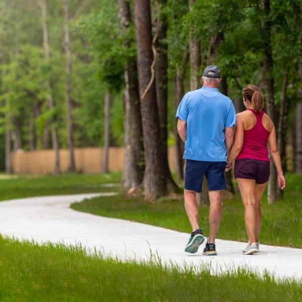 couple walking on paved trail